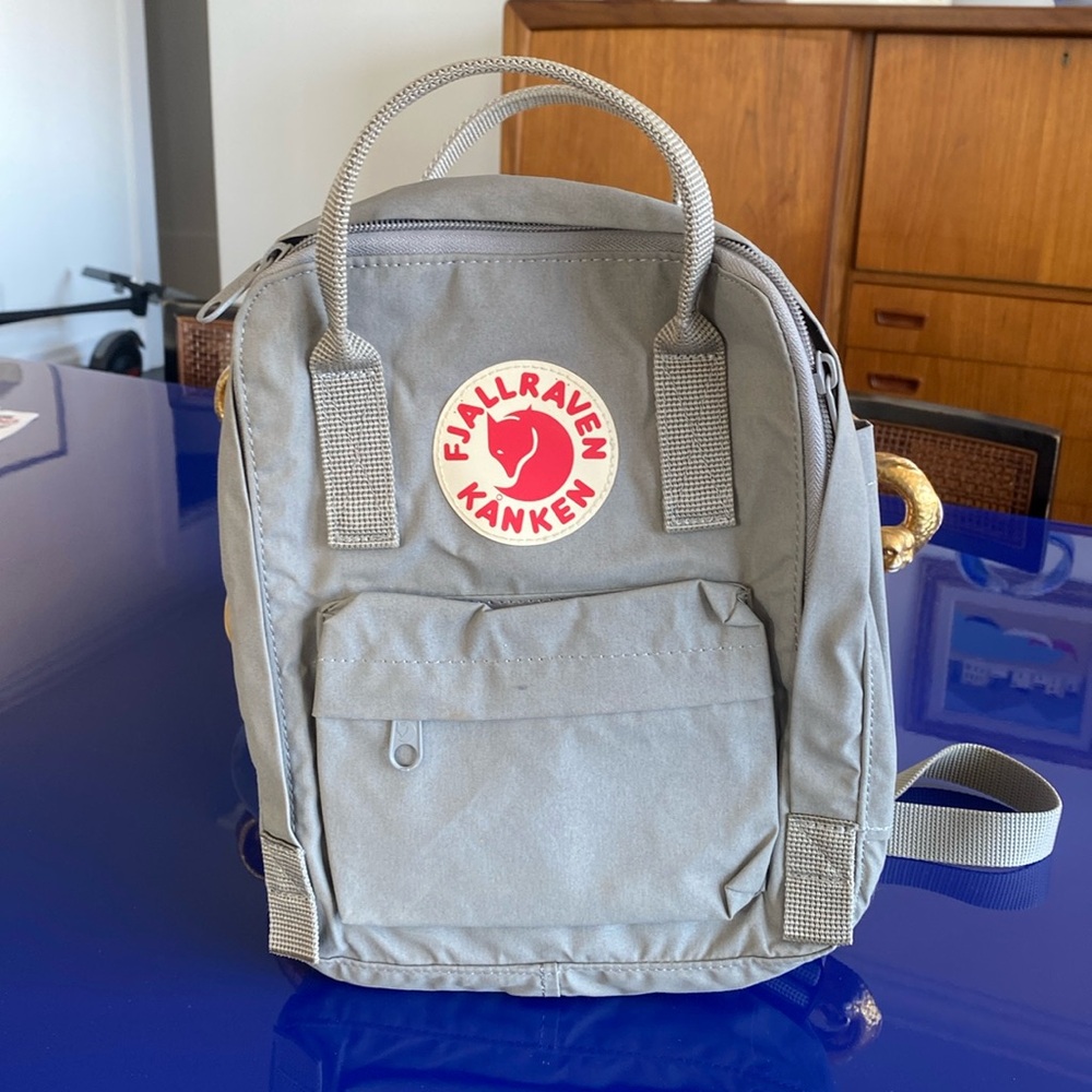 Fjallraven mini backpack grey. Great condition, rarely worn. 11.4x7.9x5.1”